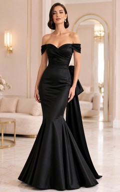 Vestido de sirena negro con escote corazón, mangas cortas, lazo, drapeado, satén, cremallera y cola larga.