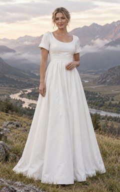 Vestido de novia de popelina de algodón estilo campestre, corte en A, escote redondo y mangas cortas con puños.