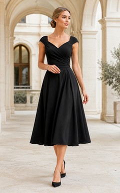 Vestido formal vintage negro de satén con escote en V y mangas cortas, corte en A y largo hasta la rodilla.