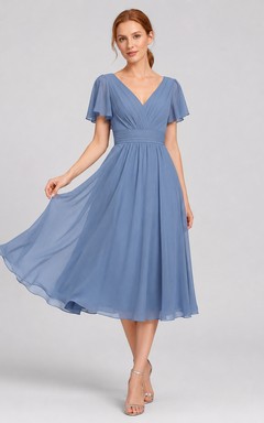 Vestido de cóctel de gasa azul acero con escote en V y cremallera en la espalda