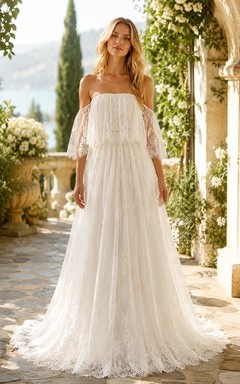 Vestido de novia de corte A con volantes de encaje y hombros descubiertos color marfil