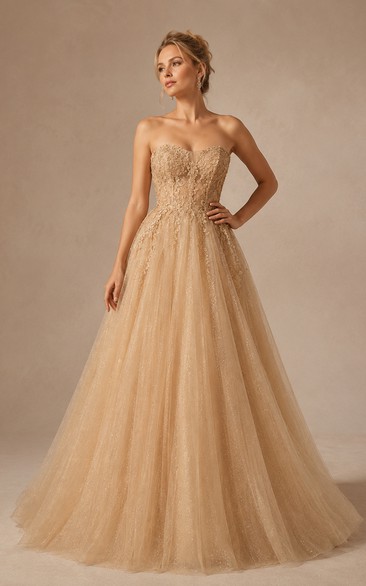Robe de bal bustier en tulle pailleté champagne, coupe trapèze, avec corsage corset