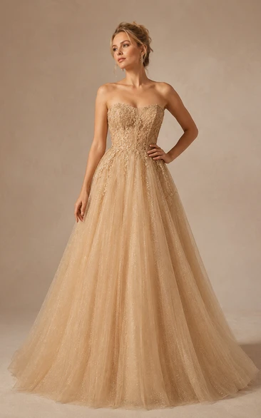 Robe de bal bustier en tulle pailleté champagne, coupe trapèze, avec corsage corset
