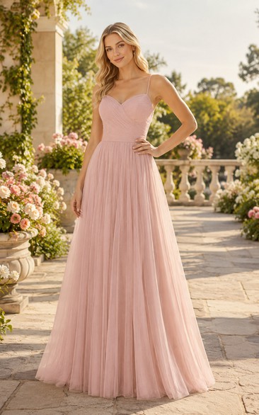 Robe de demoiselle d'honneur grande taille rose poudré, bretelles spaghetti, tulle, coupe trapèze et dos croisé