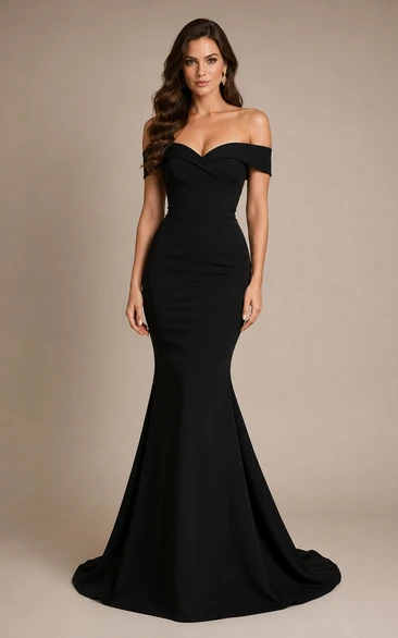 Vestido de noche negro estilo sirena con hombros descubiertos y escote corazón.