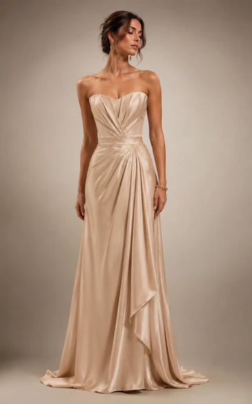 Vestido de gala de satén color champán con corpiño estructurado y largo hasta el suelo.