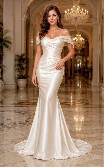 Vestido de novia de satén estilo sirena con hombros descubiertos y escote corazón.