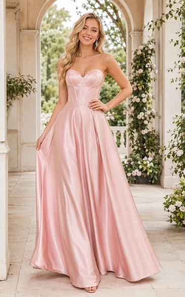 Vestido de fiesta de satén rosa empolvado con corte en A y corpiño palabra de honor.