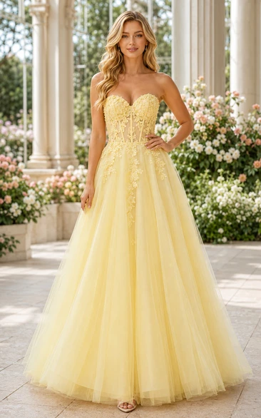 Vestido de fiesta de gala sin tirantes de tul color narciso con corpiño de apliques florales