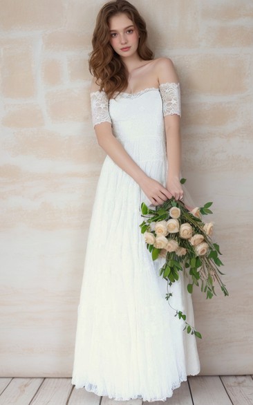 Robe de mariée bohème en dentelle, coupe trapèze, épaules dénudées, manches courtes