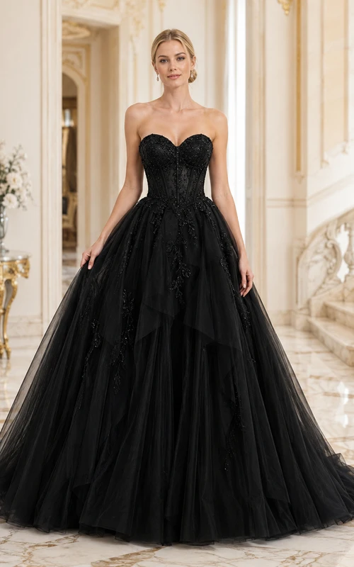 Vestido de fiesta largo negro sin tirantes, escote corazón, corsé, encaje floral, tul, volantes y falda de gala.