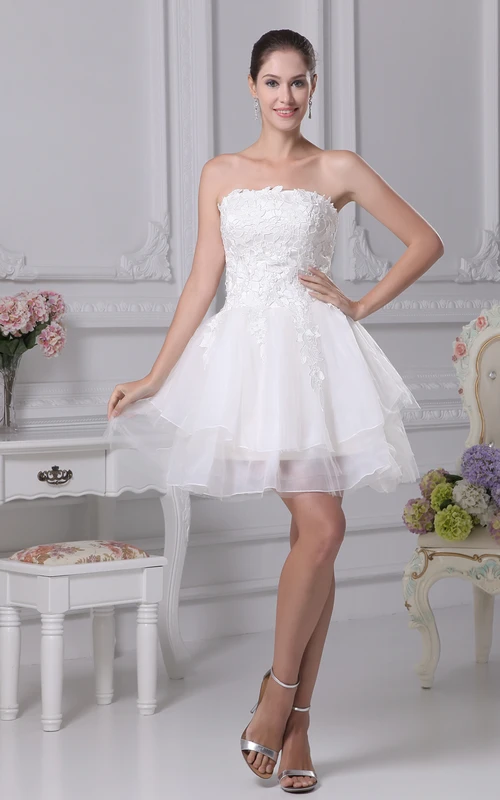 Ravissante robe bustier en tulle trapèze ornée d'appliqués