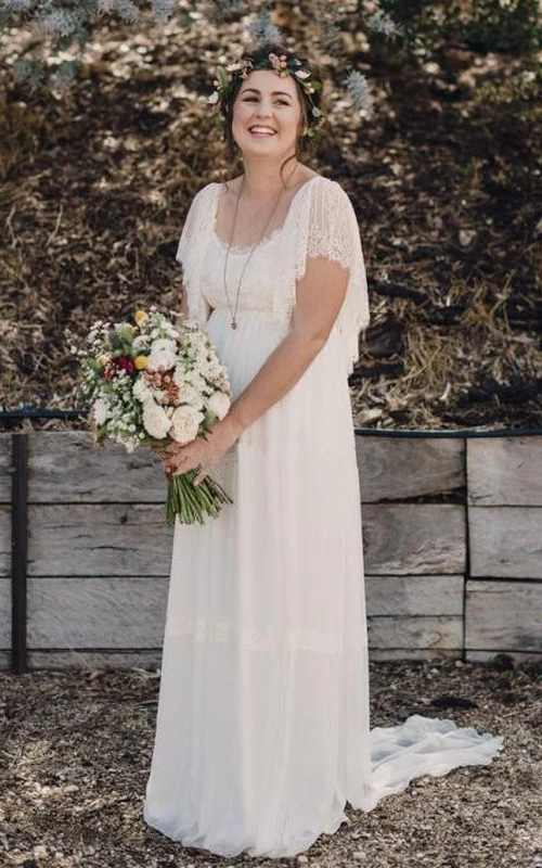 Vestido de novia bohemio de talla grande con encaje, mangas cortas y escote redondo en la espalda.