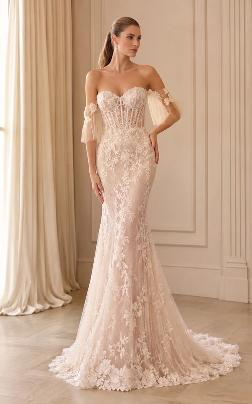 Robe de mariée sirène en dentelle, décolleté cœur, manches bouffantes, traîne chapelle, ornée d'appliques, style bal, pour une mariée de bal.