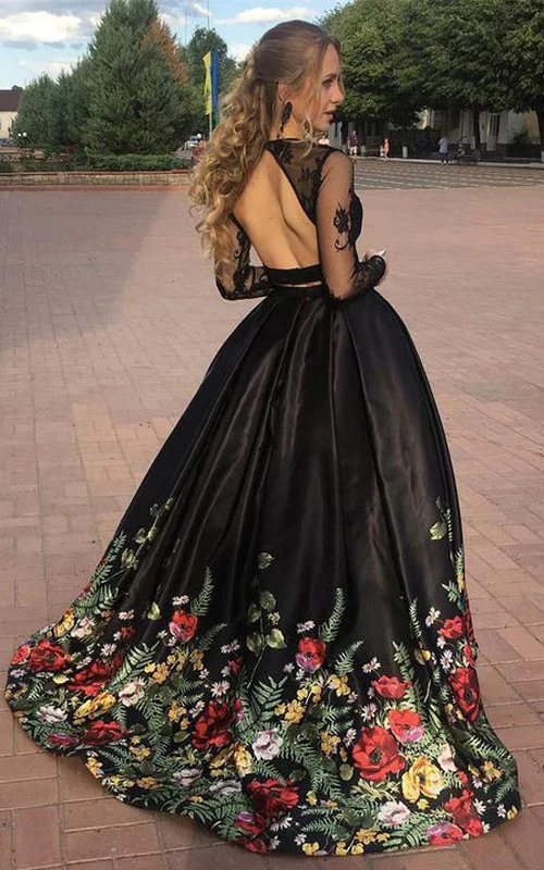 Vestido de fiesta negro de dos piezas con escote en A, mangas largas y efecto ilusión, con bordado floral.