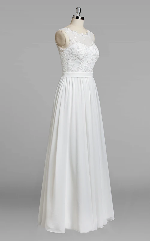 Robe de mariée sans manches à col rond, jupe trapèze en mousseline et corsage en dentelle, ornée d'une encolure bijou et d'un bustier en dentelle