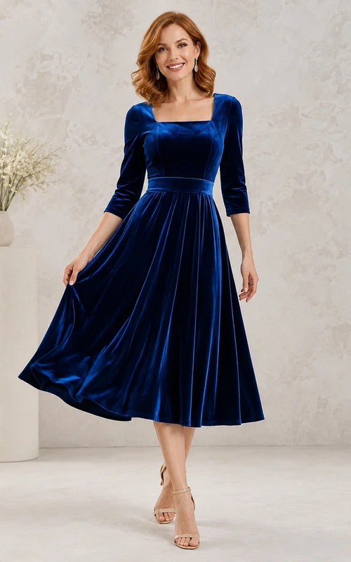 Vestido vintage de terciopelo azul marino oscuro con escote cuadrado, manga tres cuartos y corte en A, largo hasta la rodilla.