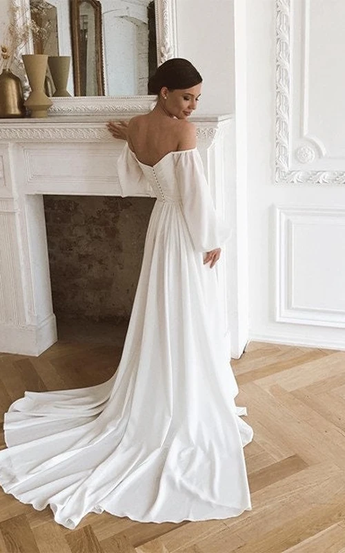 Elegantes Brautkleid mit herzförmigem Ausschnitt, überkreuzten Puffärmeln und langer Schleppe
