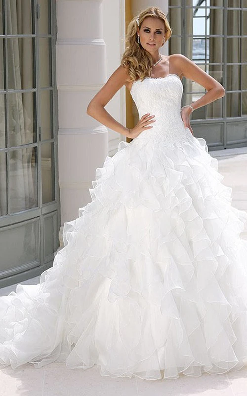 Vestido de novia de organza sin mangas, largo hasta el suelo, con falda de corte A, volantes en cascada y apliques.