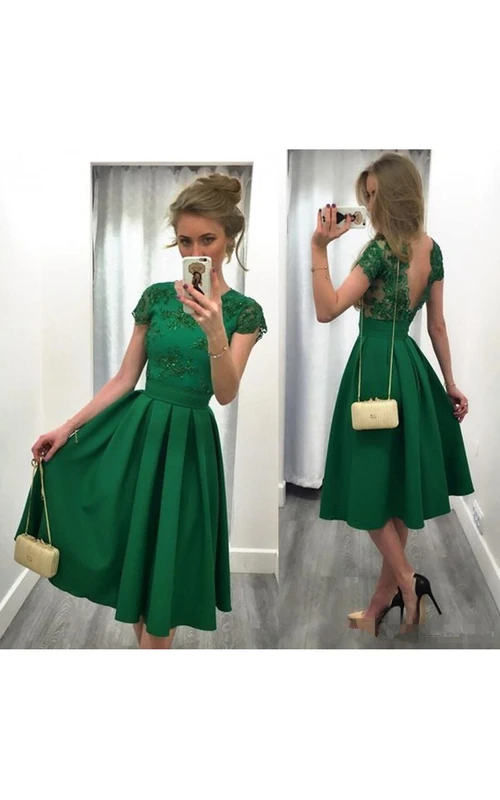 Vestido de fiesta largo midi sin espalda, corte A, con apliques y espalda en V.
