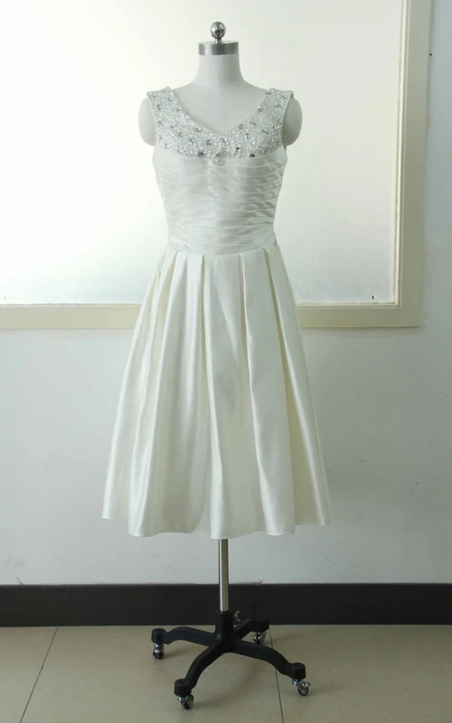 Vestido de corte A, largo hasta la rodilla, escote en V, sin mangas, con cuentas, flores, cremallera, corsé en la espalda, gasa, tul, encaje, lentejuelas y satén.
