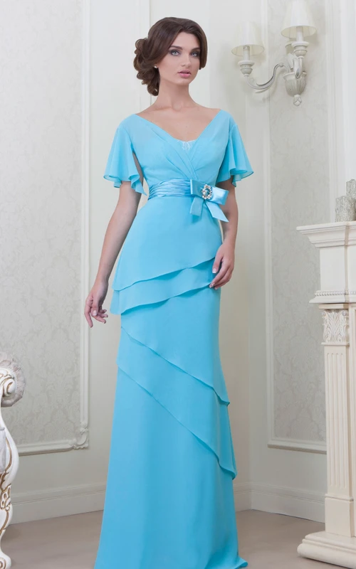 Vestido de dama de honor de gasa largo hasta el suelo con escote en V, mangas abullonadas, lazo, volantes y espalda en V.