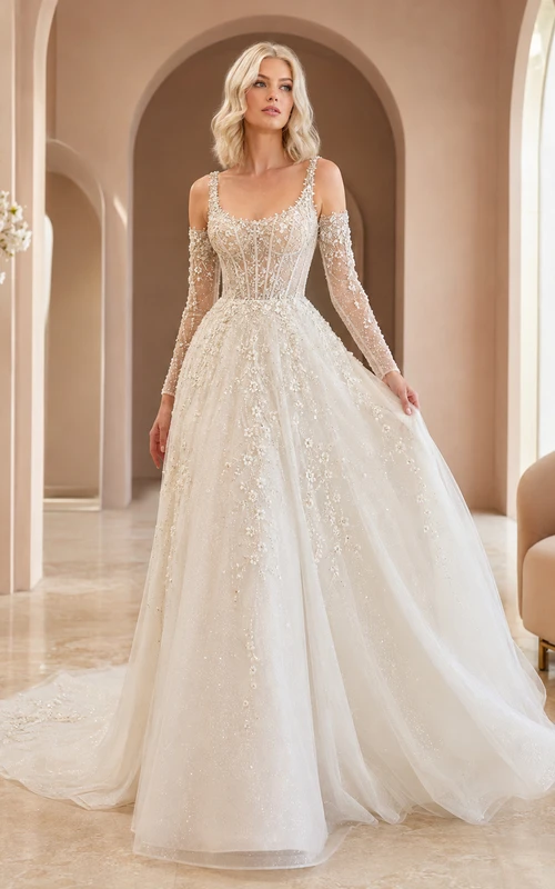 Robe de mariée de bal en dentelle et tulle superposés, asymétrique, à une épaule, manches longues transparentes, coupe trapèze, traîne chapelle et manches longues transparentes.