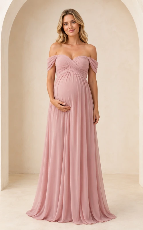 Robe de demoiselle d'honneur de maternité rose poudré, épaules dénudées, décolleté cœur, en mousseline, longueur au sol, style empire.