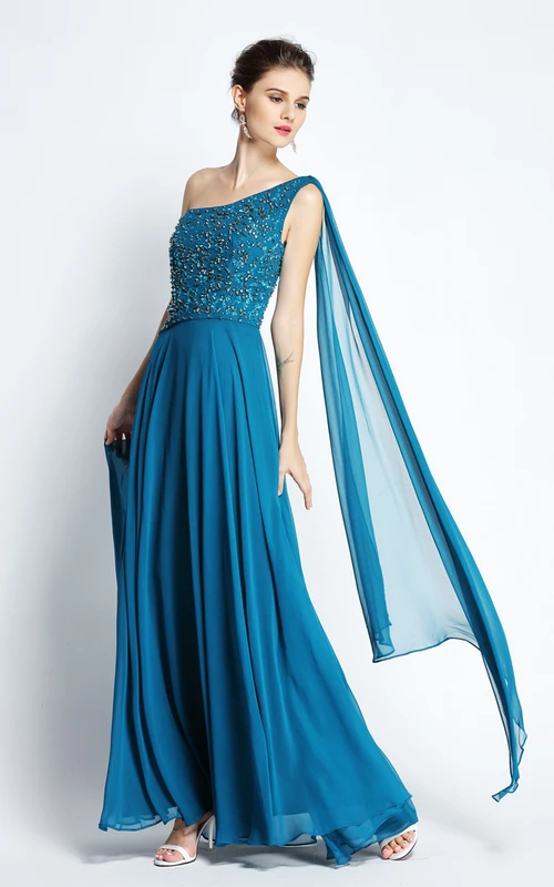 Vestido de fiesta largo hasta el suelo, de gasa, con un solo hombro, sin mangas, con detalles de pedrería y drapeado.
