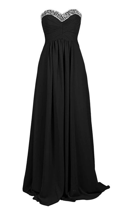 Vestido de gasa con escote corazón y corte en A, con corpiño de lentejuelas.