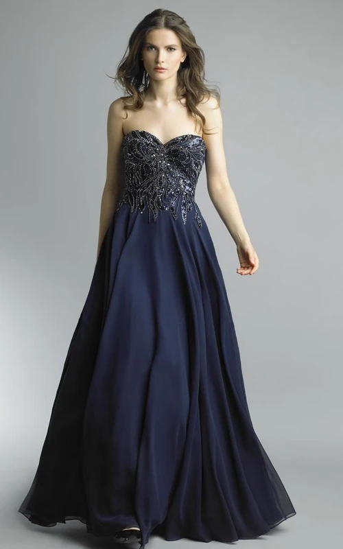Robe trapèze longue sans manches en mousseline dos nu à décolleté cœur
