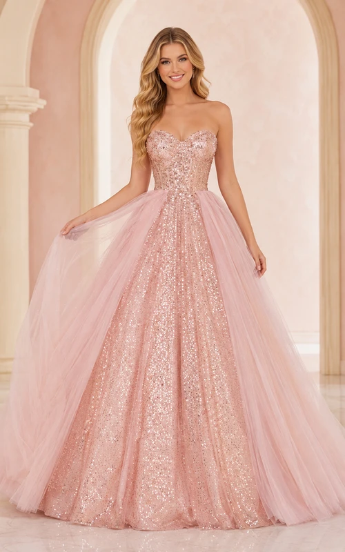 Vestido de fiesta formal de princesa color rosa empolvado, sin tirantes, con escote corazón y sobrefalda de tul con lentejuelas.