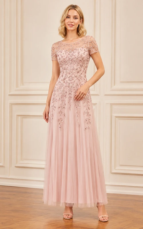 Robe en tulle rose poudré à manches courtes et corsage en dentelle, longueur thé