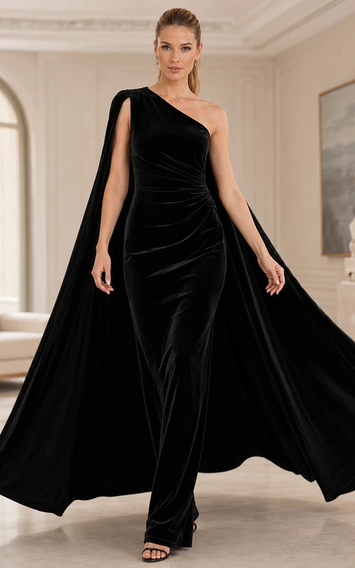 Vestido de fiesta formal de terciopelo negro con capa asimétrica y un solo hombro.