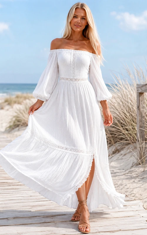 Vestido de playa blanco estilo bohemio con hombros descubiertos, mangas abullonadas, ribete de encaje, corte en A y largo hasta los tobillos.
