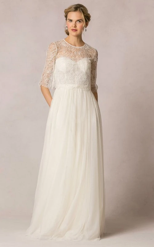 Vestido de novia de tul largo con escote redondo, mangas cortas y encaje, corte tubo.