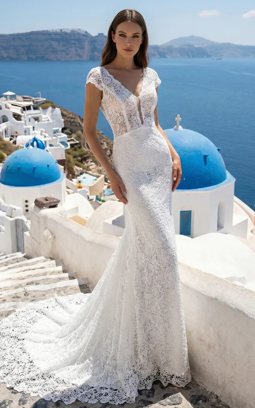 Vestido de novia bohemio de encaje con mangas cortas