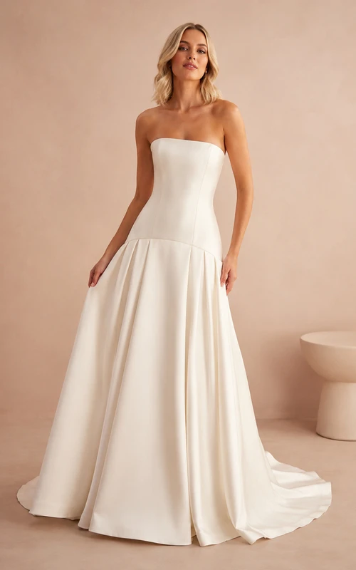 Robe de mariée moderne bustier taille basse coupe trapèze pour mariage en studio