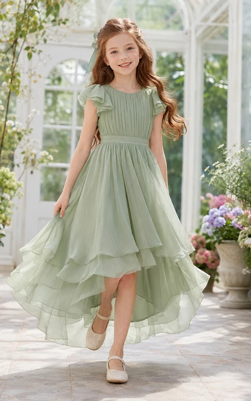 Robe de demoiselle d'honneur champêtre en mousseline sauge, manches pétales, coupe trapèze asymétrique, volants en cascade