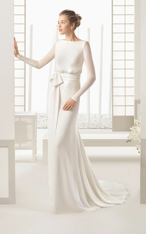 Vestido largo y fluido de manga larga para renovación de votos con lazo y botones decorativos.