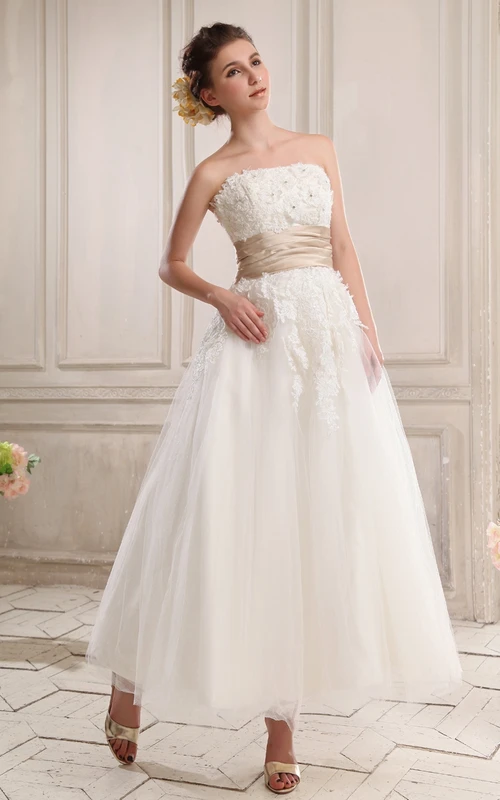 Robe bustier longueur cheville ornée d'appliqués et fermeture éclair au dos