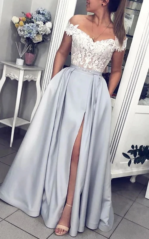 Robe de soirée longue en dentelle bicolore fendue sur le devant, épaules dénudées, coupe trapèze, fendue sur le devant