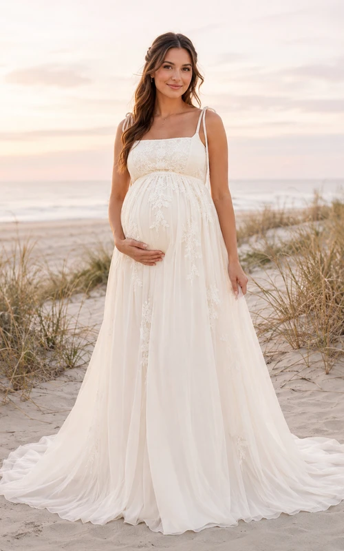 Robe de mariée en tulle style empire, épaules dénudées, longueur au sol, idéale pour la plage.