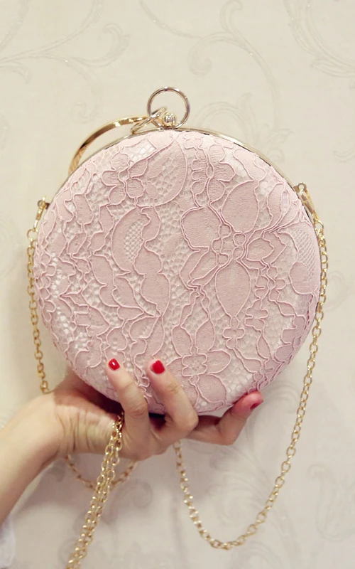 Runde, mit Spitze besetzte Kristall-Clutch