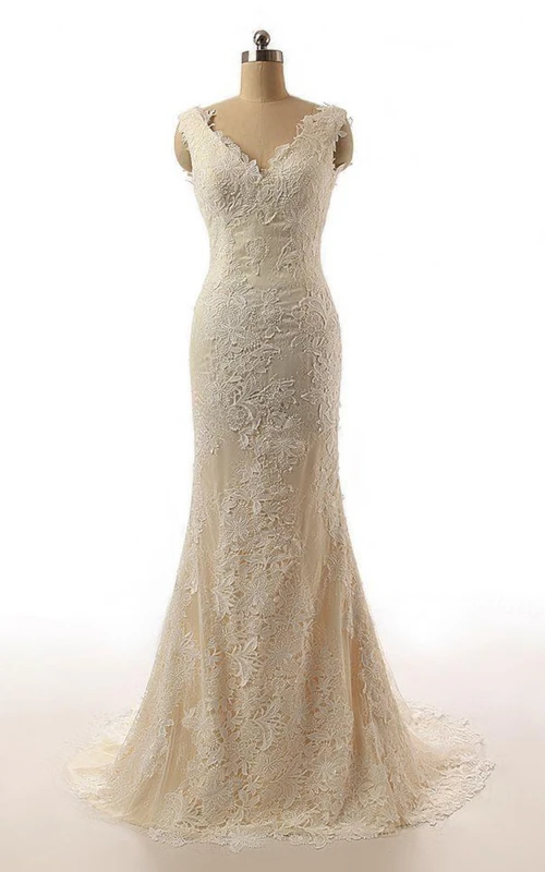 Vestido de novia de encaje con mangas cortas y cola larga estilo sirena