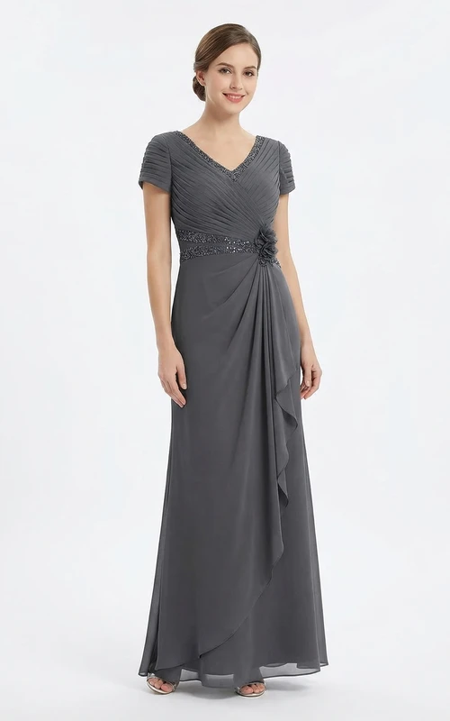 Robe en jersey à col en V ornée de perles et drapée