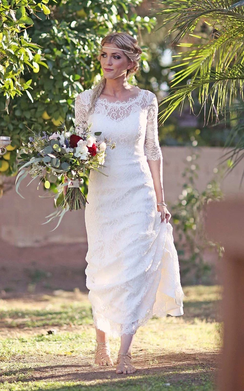 Robe de mariée sirène en satin et dentelle, manches illusion, boutons et fermeture éclair, décolleté en goutte d'eau