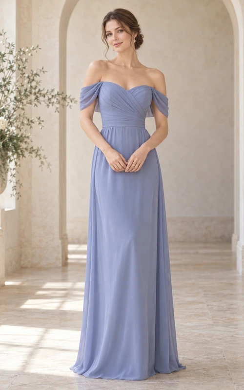 Vestido de dama de honor largo hasta el suelo, de gasa color bígaro con escote corazón y hombros descubiertos.