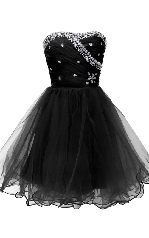 Vestido palabra de honor de corte A con corpiño de pedrería