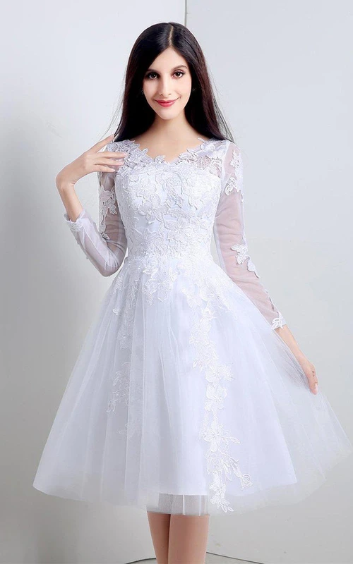 Edles knielanges Kleid aus Spitze und Tüll mit langen Ärmeln